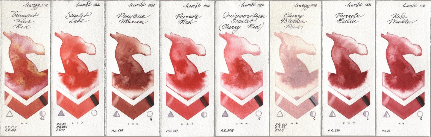 Holbein Artists Watercolor 502 Trumpet Vine Red, 022 Scarlet Lake, 008 Perylene Maroon, 007 Pyrrole Red, 027 Quinacridone Scarlet (Cherry Red), 503 Cherry Blossom Pink, 006 Pyrrole Rubin, 012 Rose Madd watercolor swatch