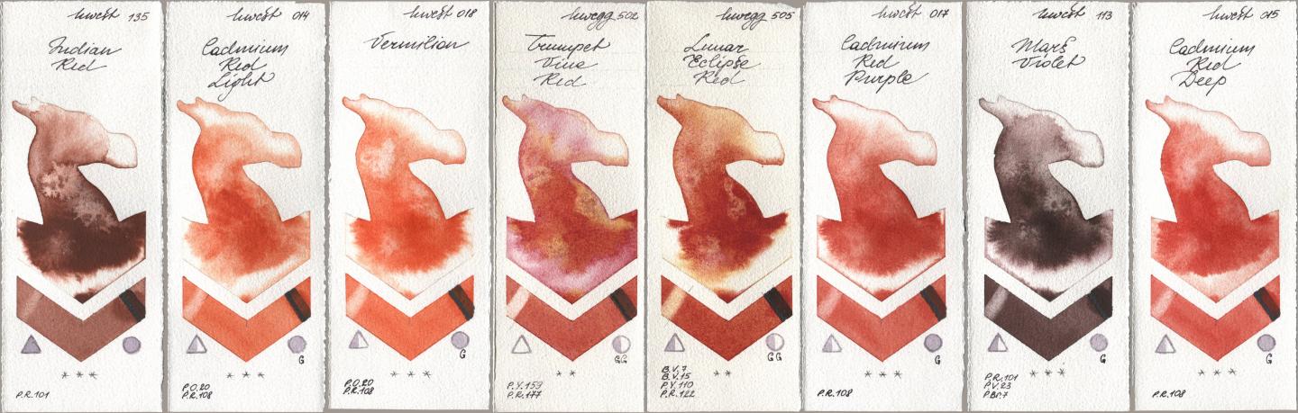 Holbein Artists Watercolor 135 Indian Red, 014 Cadmium Red Light, 018 Vermilion, 502 Trumpet Vine Red, 505 Lunar Eclipse Red, 017 Cadmium Red Purple, 113 Mars Violet, 015 Cadmium Red De watercolor swatch