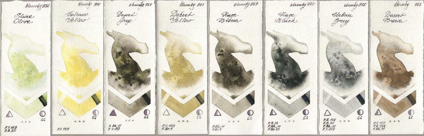 Shminke Horadam Aquarell 932 Shire Olive, 911 Volcano Yellow, 925 Desert Grey, 921 Desert Yellow, 969 Haze Brown, 970 Haze Black, 956 Urban Grey, 923 Desert Bro watercolor swatch