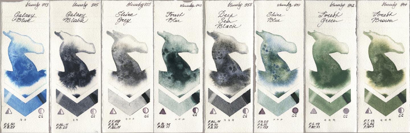 Shminke Horadam Aquarell 973 Galaxy Blue, 975 Galaxy Black, 935 Shire Grey, 943 Forest Blue, 955 Deep Sea Black, 934 Shire Blue, 942 Forest Green, 944 Forest Bro watercolor swatch